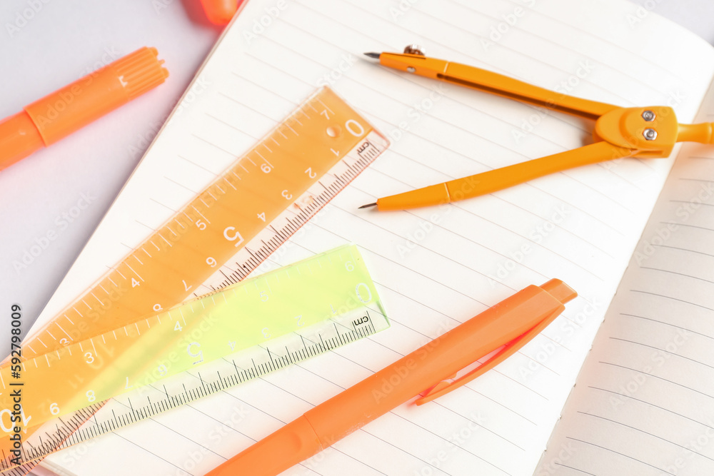 Notebook and stationery supplies on white background