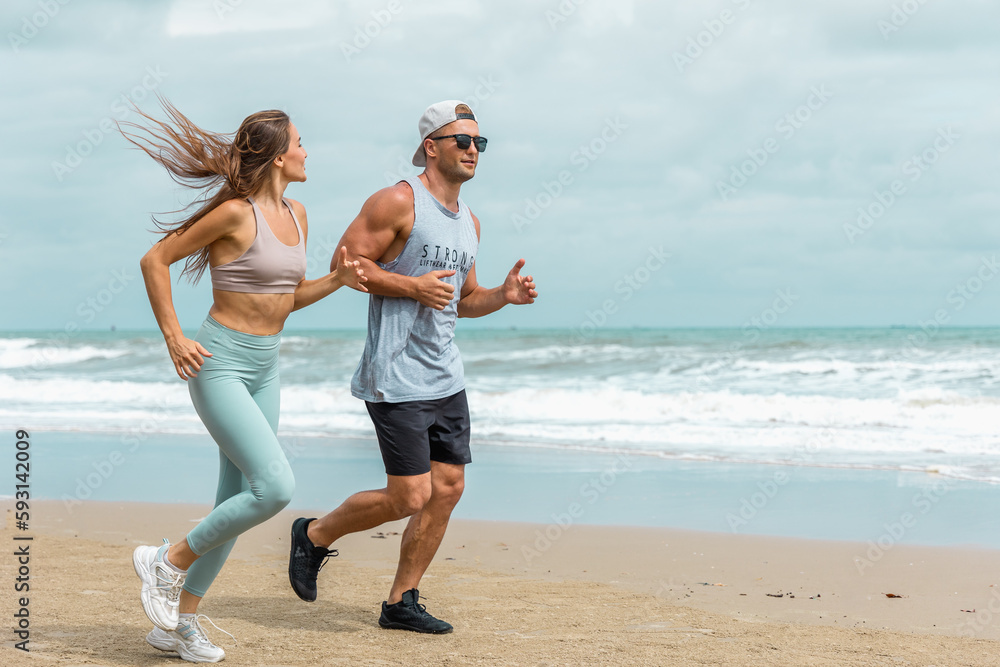 caucasian sport  fitness trainer go for a morning jog on the beach