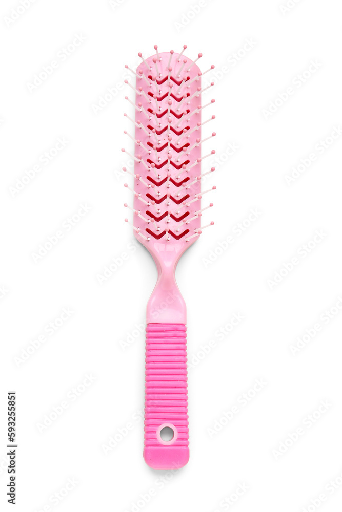 Pink hair brush on white background