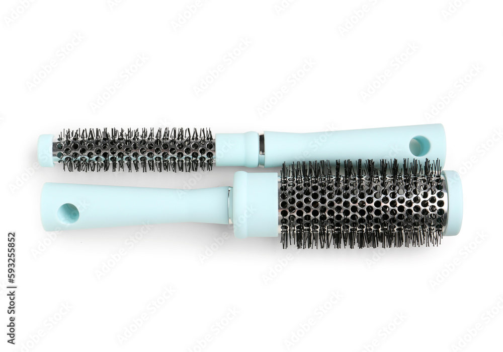 Round hair brushes on white background