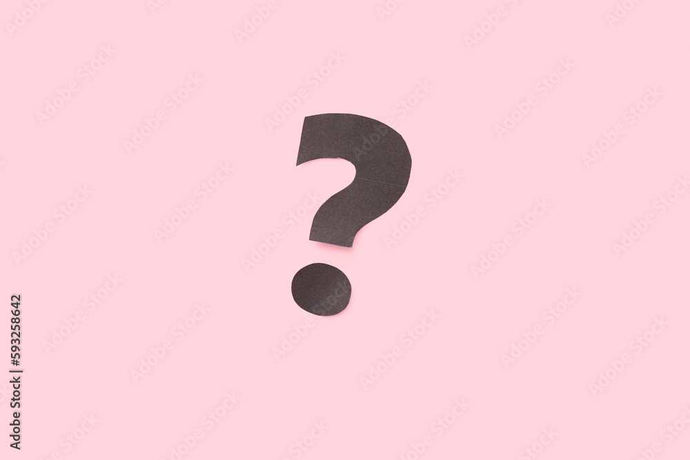 Paper question mark on pink background