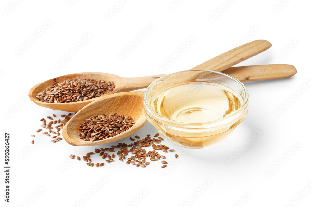 Spoons with flax seeds and bowl of oil on white background