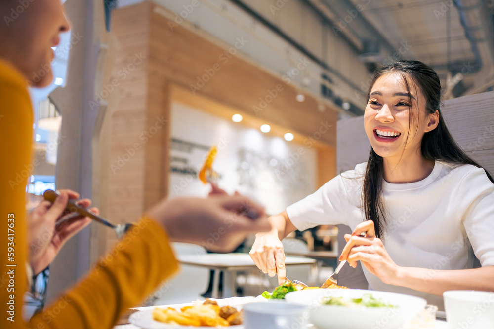 Asian beautiful women having dinner with friend in restaurant together. 