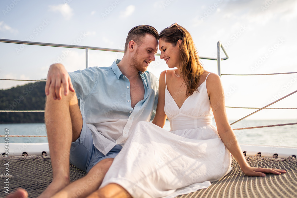 Caucasian romantic couple looking at beautiful view during yachting.