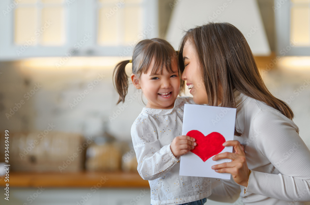 Daughter giving mother postcard