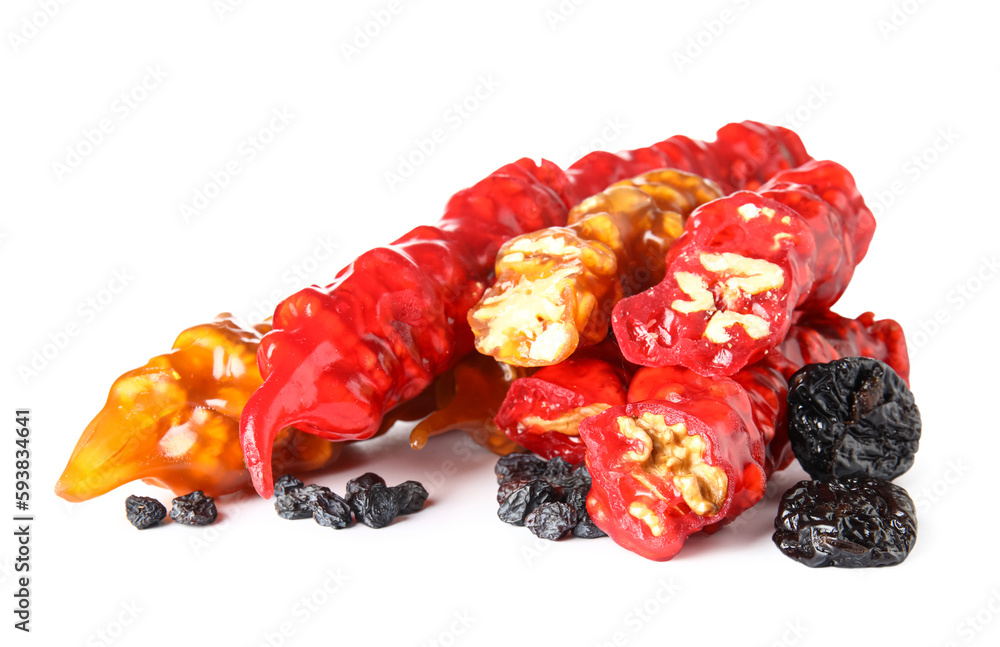 Delicious churchkhela with raisins and prunes isolated on white background