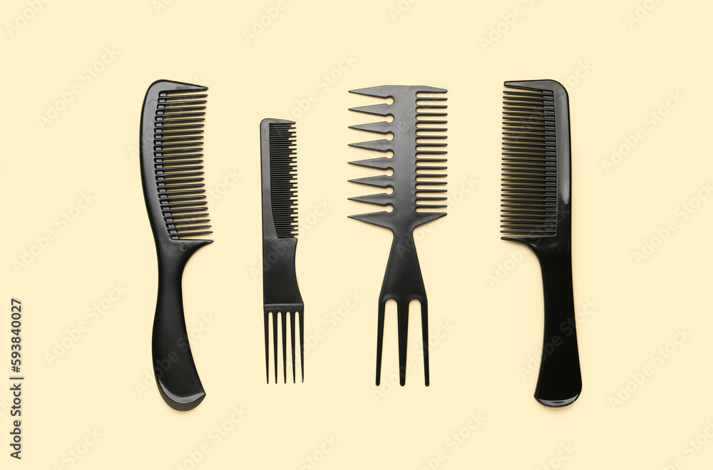 Hairdressers brushes on beige background