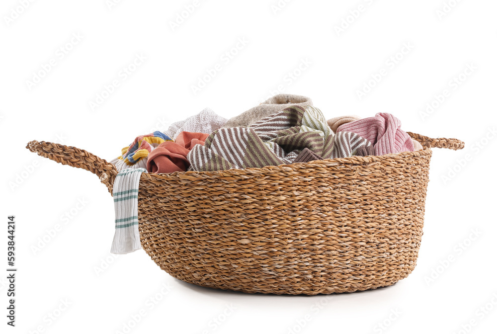 Wicker basket with dirty clothes on white background