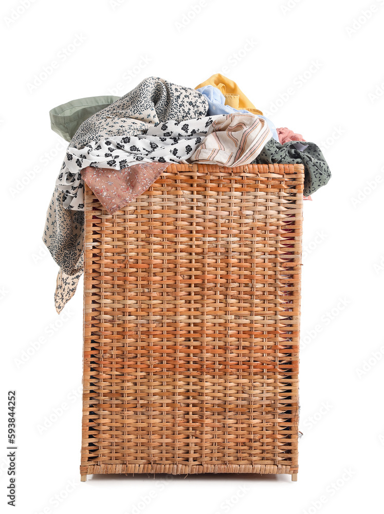 Wicker basket with dirty clothes on white background