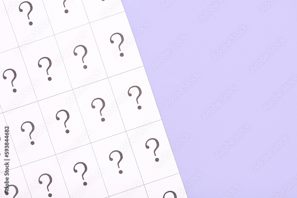 Paper with question marks on lilac background, closeup