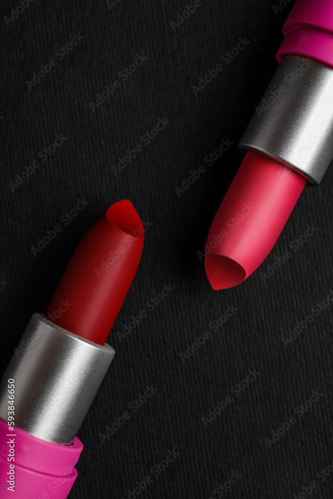 Beautiful lipsticks on dark background