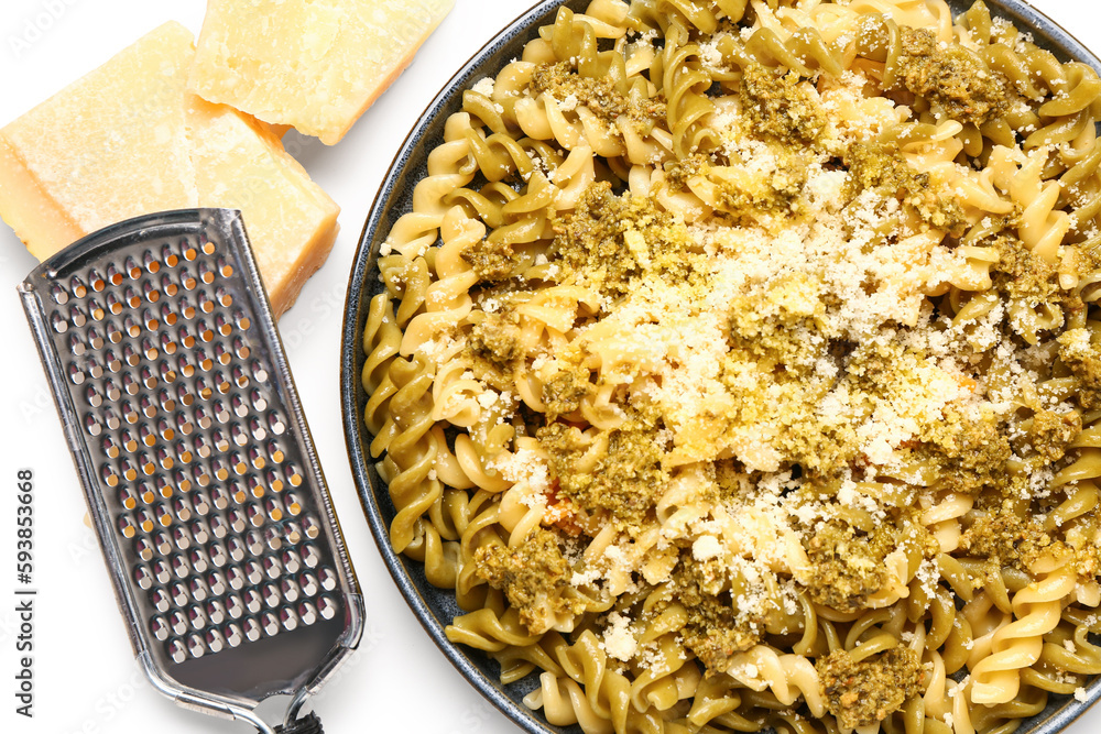 Plate of tasty Italian pasta with Parmesan cheese on white background, closeup