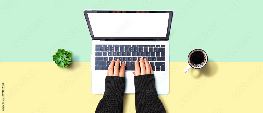 Person using a laptop computer from above