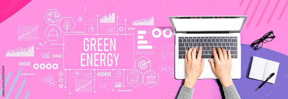 Green Energy concept with person using a laptop computer