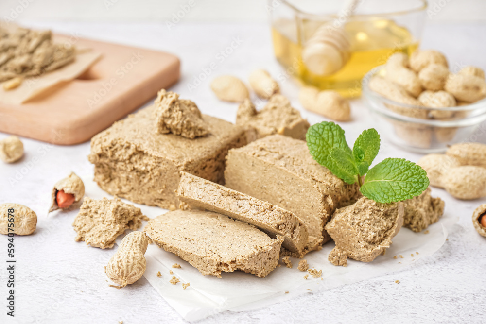 Pieces of sweet halva on light background