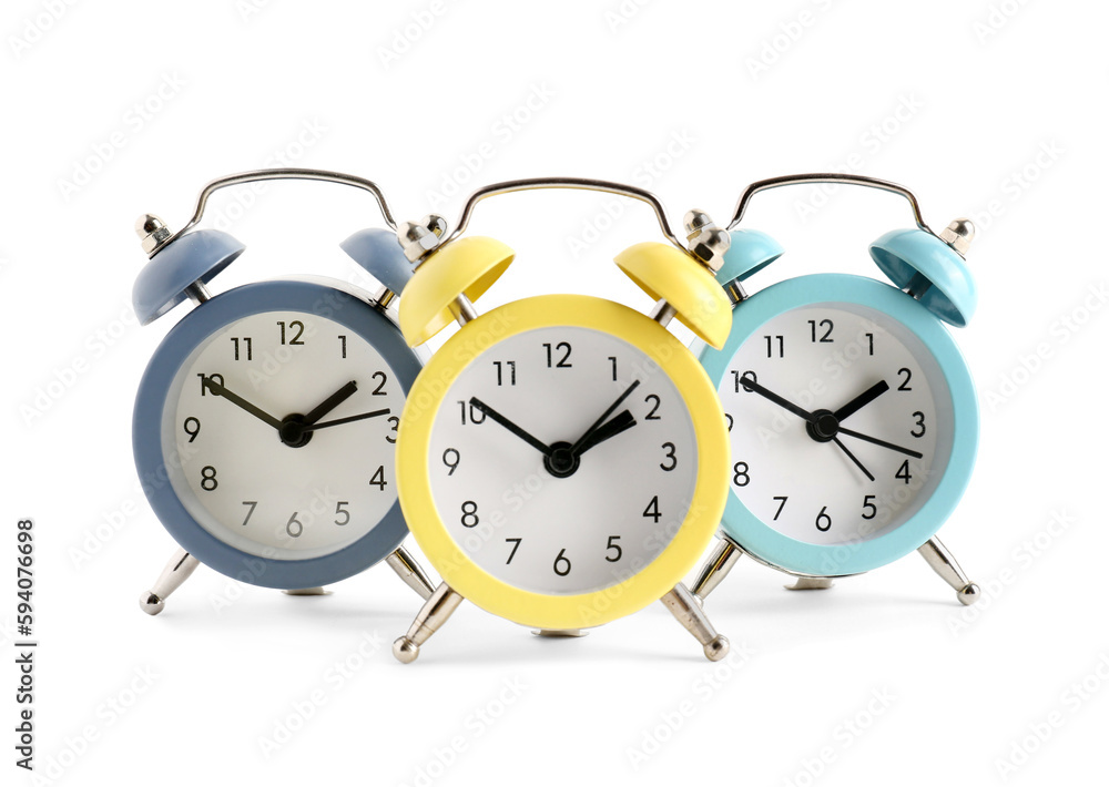 Set of alarm clocks on white background