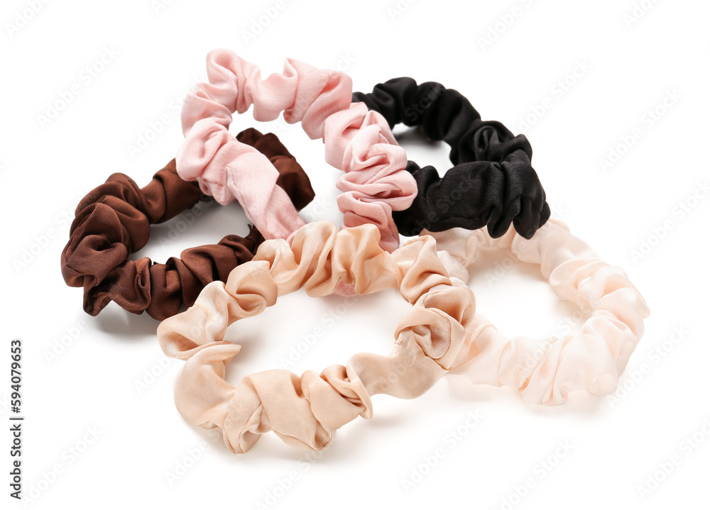 Set of stylish scrunchies on white background