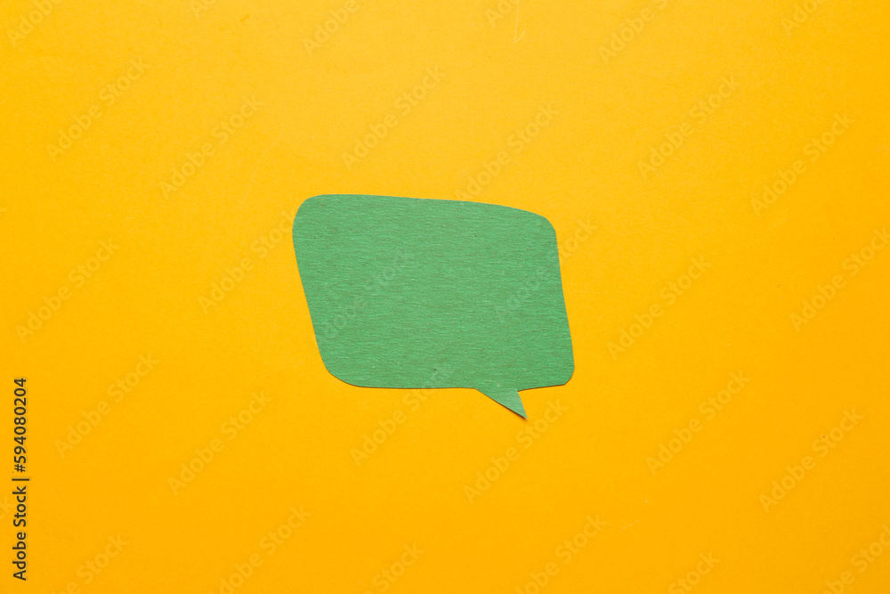 Blank paper speech bubble on orange background