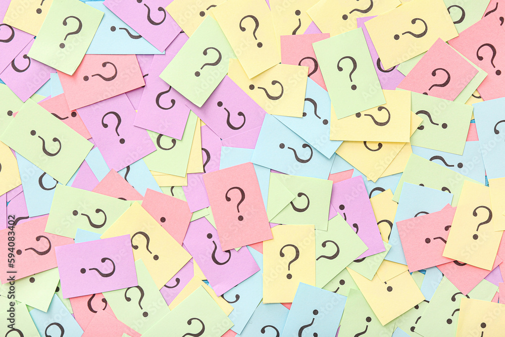 Colorful papers with question marks as background