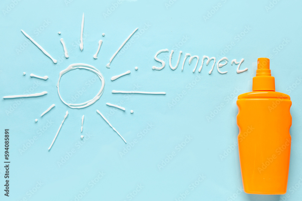 Word SUMMER with sun made of sunscreen cream on blue background