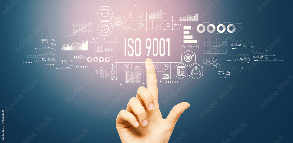 ISO 9001 theme with hand pressing a button on a technology screen