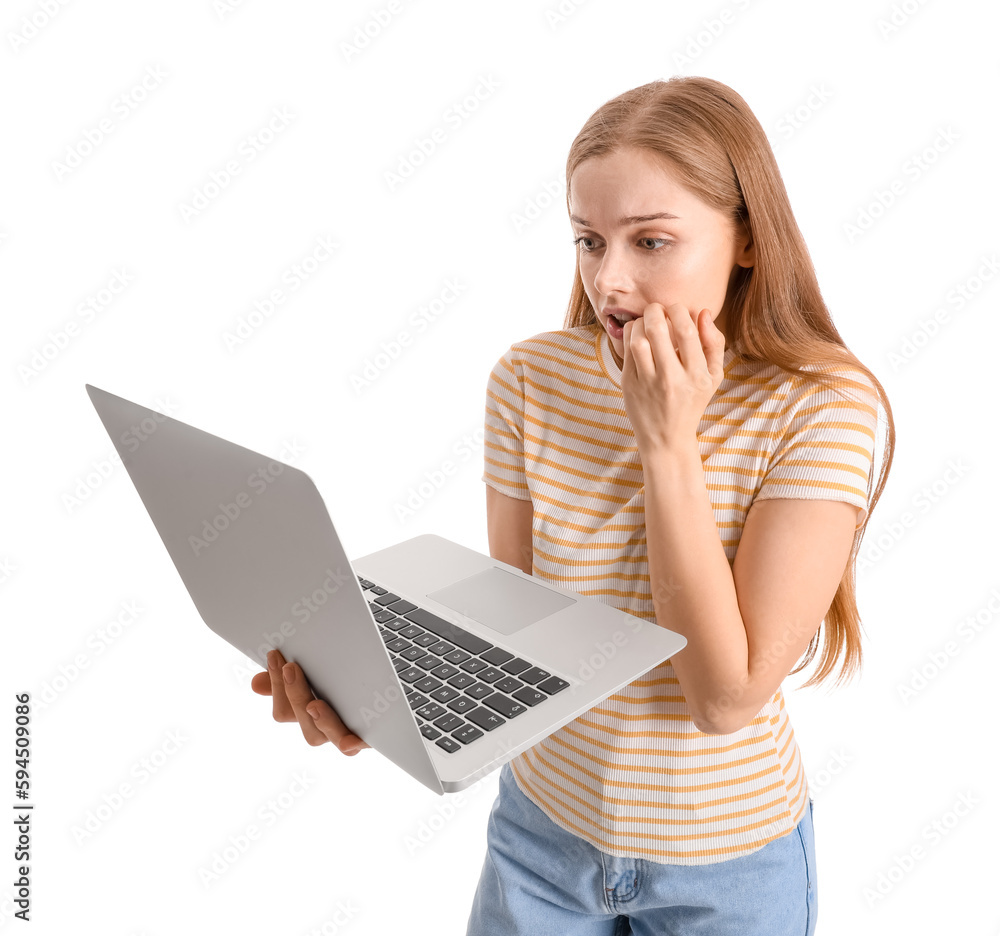 Young woman with laptop biting nails on white background