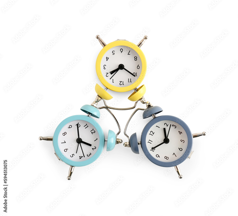 Composition with alarm clocks on white background