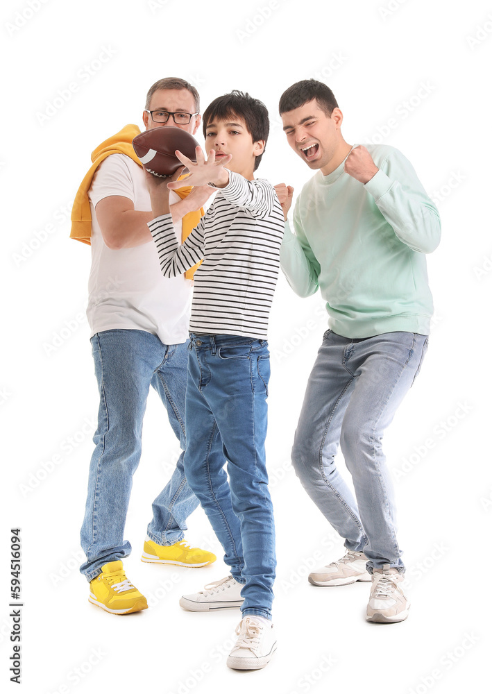 Happy little boy with his dad and grandfather playing rugby on white background