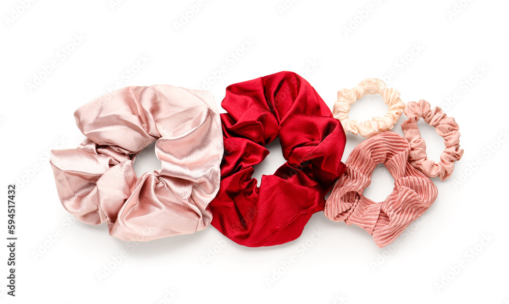 Set of stylish scrunchies on white background