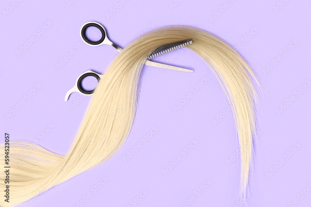 Hair strand with scissors on violet background