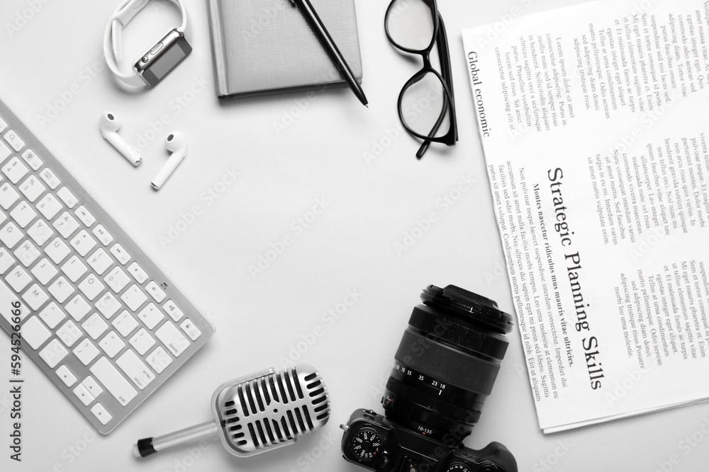 Frame made of journalists equipment on light background