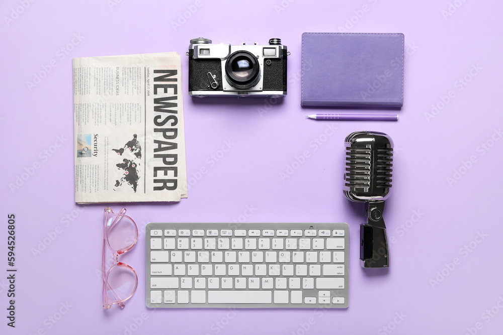 Frame made of journalists equipment on lilac background