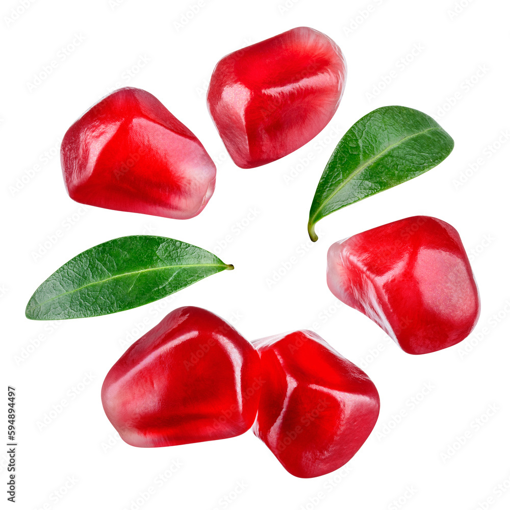 Pomegranate seeds isolated. Pomegranate grains with leaves flat lay on white background. Pomegranate