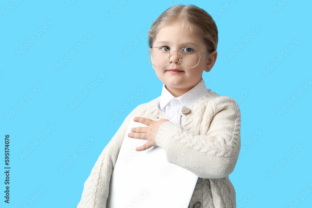 Funny little businesswoman with laptop on blue background