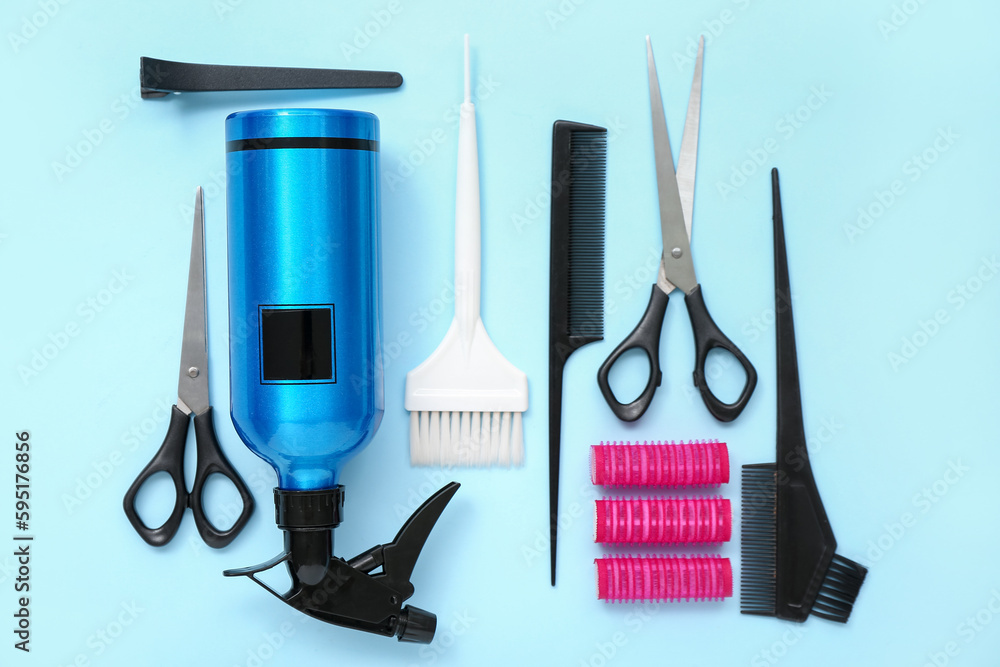 Composition with hairdressing accessories on blue background