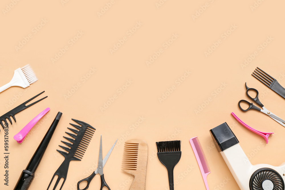 Frame made of hairdressing accessories on beige background