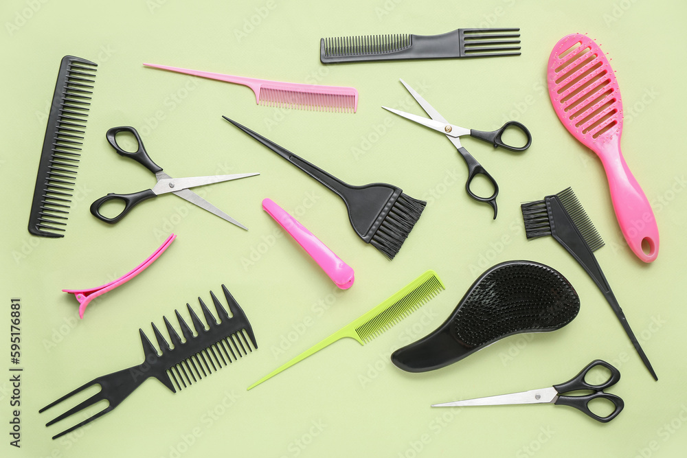 Composition with hairdressing accessories on green background