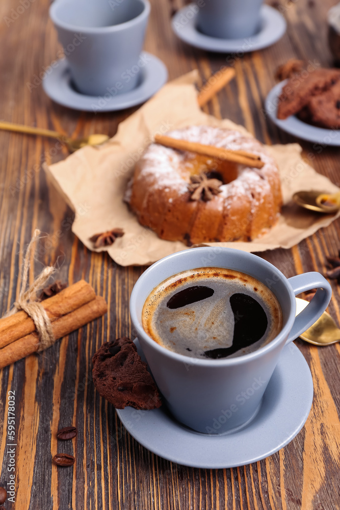 Cup of coffee on wooden table, closeup