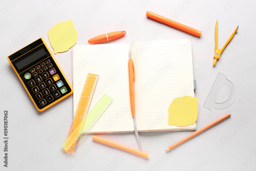 Notebook and stationery supplies on white background