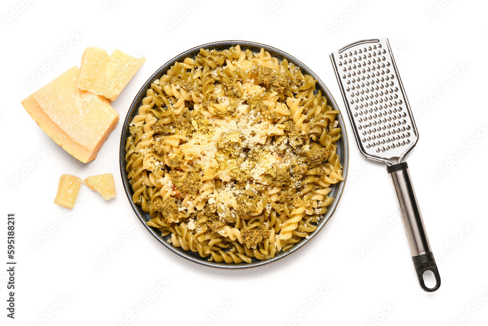 Plate of tasty Italian pasta with Parmesan cheese and grater on white background