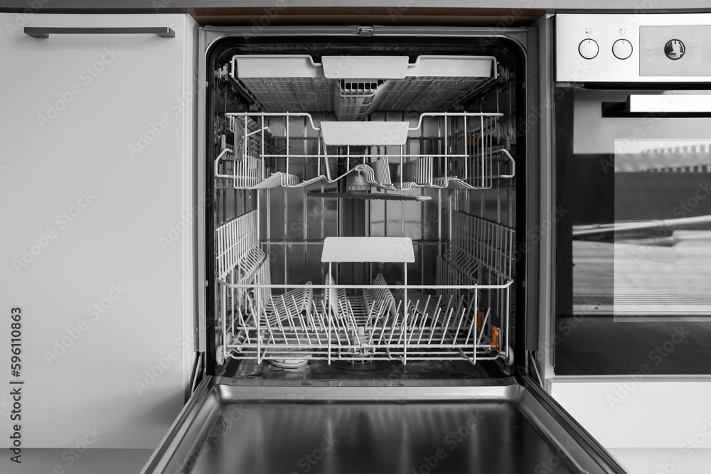 Open dishwasher in modern kitchen