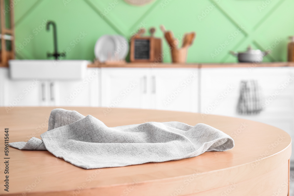 Napkin on wooden table in kitchen