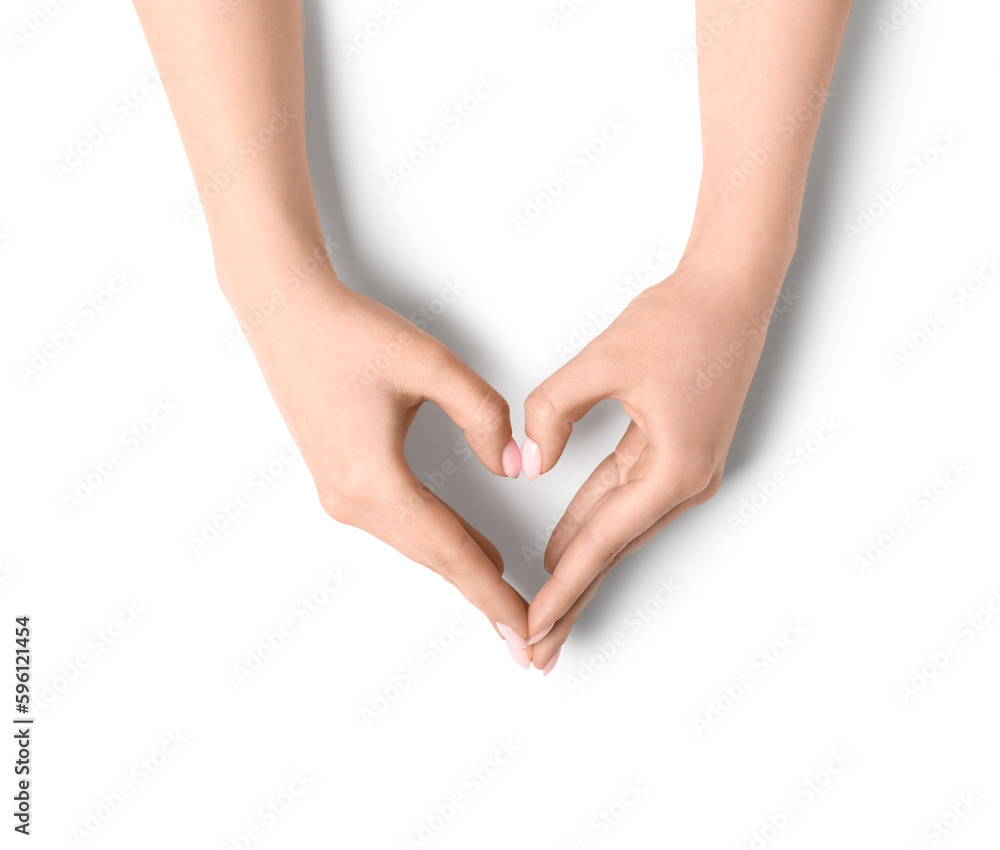 Woman making heart with her hands on white background