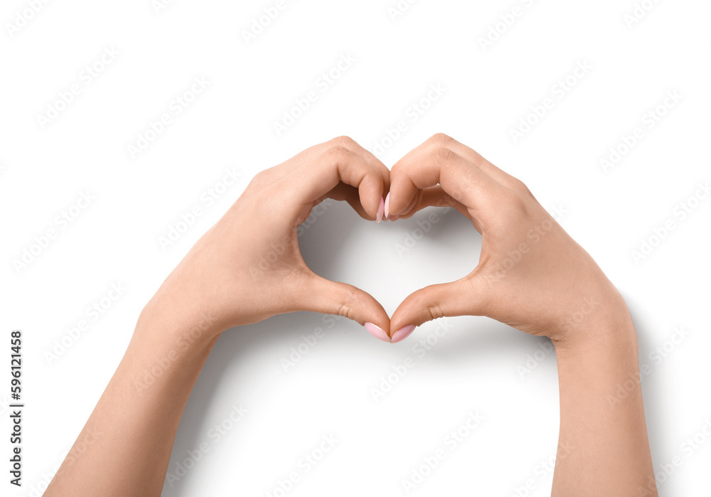 Woman making heart with her hands on white background