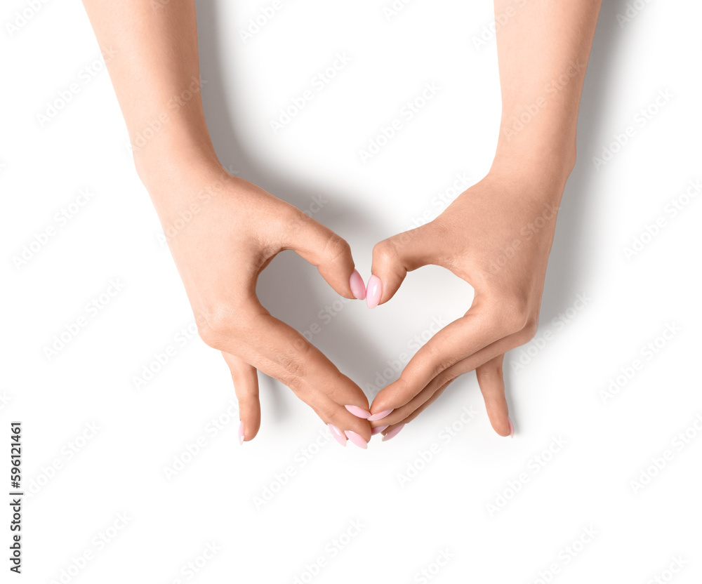 Woman making heart with her hands on white background