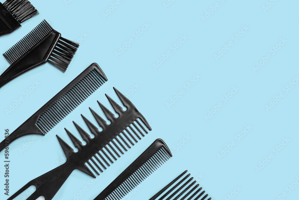 Hairdressers brushes on blue background