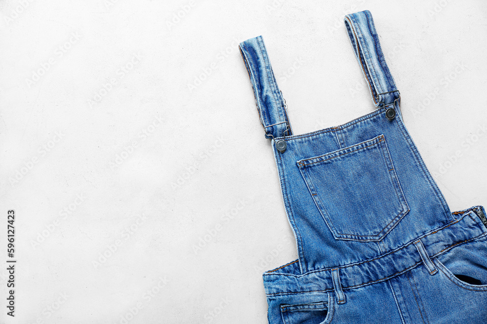 Denim jumpsuit on white background