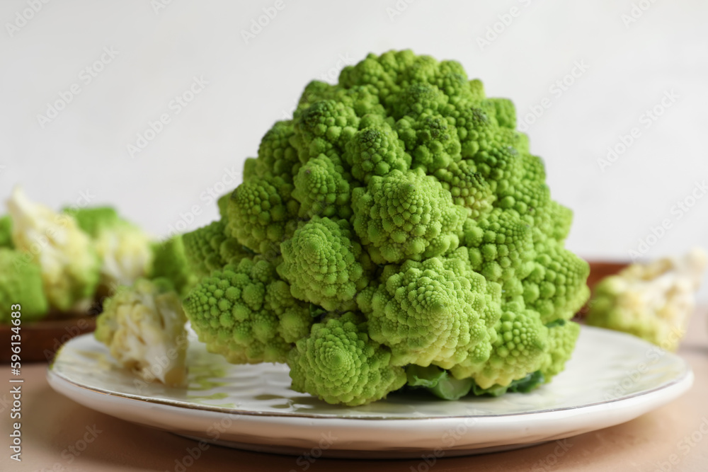 Plate with romanesco cabbage on beige table