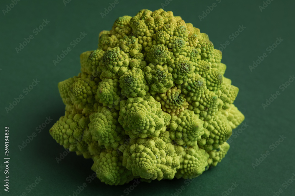 Romanesco cabbage on green background