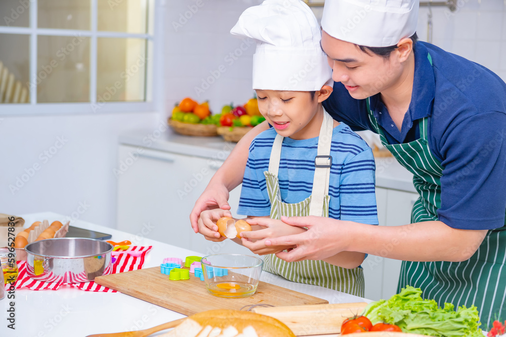 father and son cooking